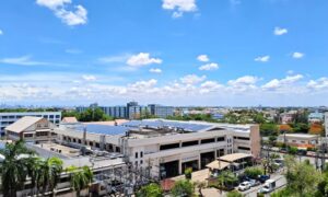 Commercial property with visible utility equipment, power lines, and surrounding site features